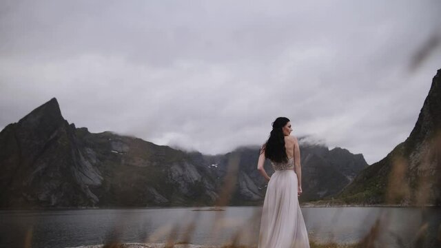 girl in a dress on a background of mountains girl with black hair
