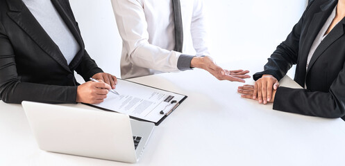 Employer or recruiter holding reading a resume during about colloquy his profile of candidate, employer in suit is conducting a job interview, manager resource employment and recruitment concept