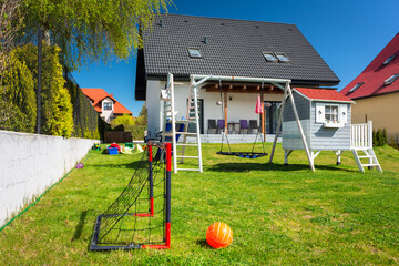 Garden playground for children with a mini soccer goal