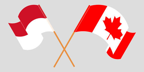 Crossed and waving flags of Indonesia and Canada