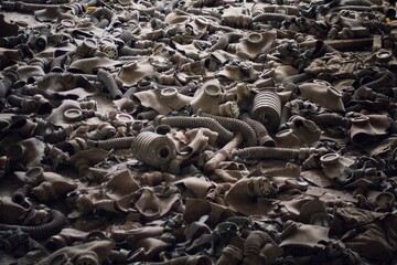 A pile of soviet-era gas masks in an abandoned building in Pripyat, Ukraine, site of the 1986 Chernobyl nuclear desaster and center of the Chernobyl exclusion zone. 