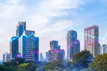 Obraz premium Forex and stock market chart hologram over panorama city view of Bangkok, the financial center in Asia. The concept of international trading. Double exposure.
