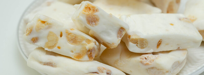 Traditional confections made with sugar or honey, roasted nuts and whipped egg whites