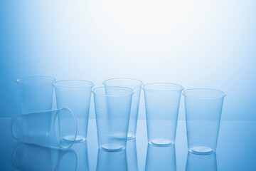 plastic glasses on a blue background. anti-alcohol advertising concept