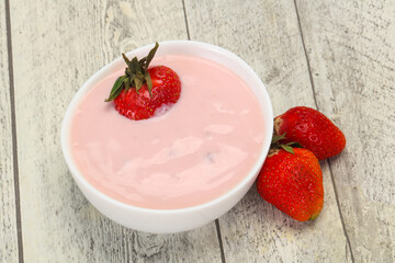 Yoghurt with strawberry in the bowl