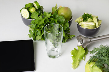 cooking vegan drink and cocktail ingredients. Fruit  vegetable smoothie and ingredients  on  white table. Diet drink