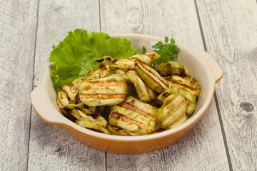 Grilled eggplant slices served basil