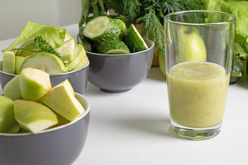 fruit  vegetable smoothie and ingredients  on  white table. Diet drink