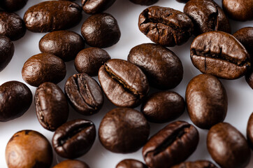 Closeup of sprinkled whole coffee beans