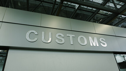 Airport customs declare sign on the wall at international terminal. Customs declare for import and export concept