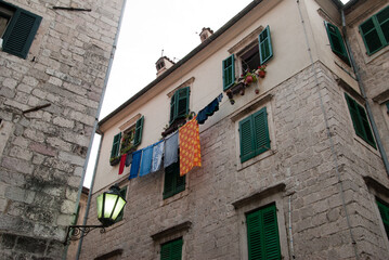 Window in stone house with open shutters