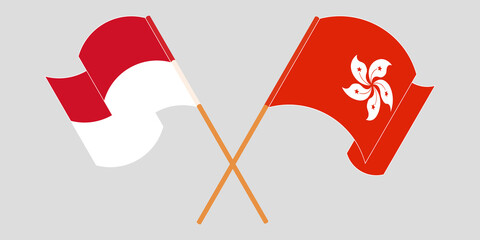 Crossed and waving flags of Indonesia and Hong Kong