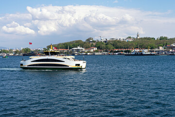 Fototapeta na wymiar Ferry in Bosphorus in Istanbul city view. Sea transportation and passenger ferry sailing