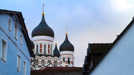Domes of Alexander Nevsky Cathedral (Estonian: Aleksander Nevski katedraal) behind old buildings....