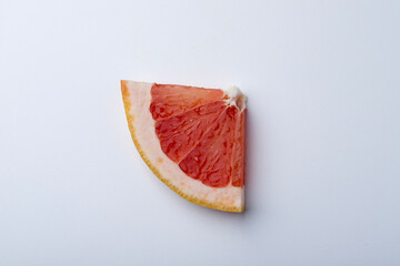 slice of Grapefruit over white background