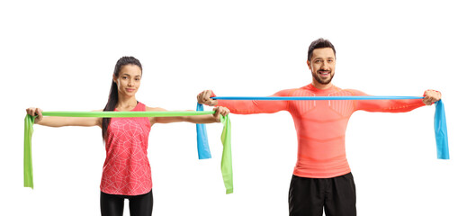 Fototapeta na wymiar Man and woman in sportswear exercising with an elastic band