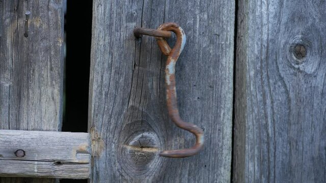 Dangling hook of wooden door. Loop 