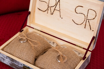 Gold wedding rings in wooden box with detail engraved Mr and Mss