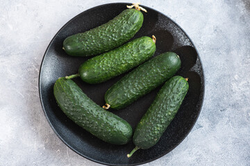 Tasty and healthy, ripe cucumbers on a plate