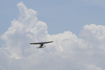 Fototapeta na wymiar Airplane up in the clouds