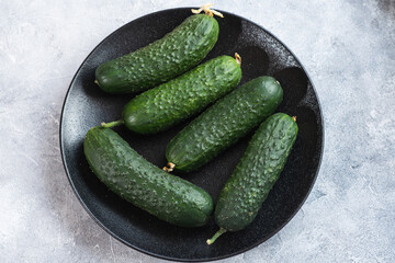 Tasty and healthy, ripe cucumbers on a plate