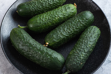 Tasty and healthy, ripe cucumbers on a plate