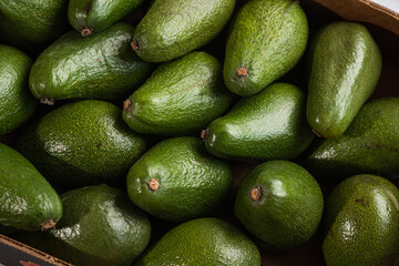 A lot of avocado close up. Healthy and tasty food. Exotic fruit