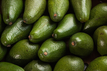 A lot of avocado close up. Healthy and tasty food. Exotic fruit
