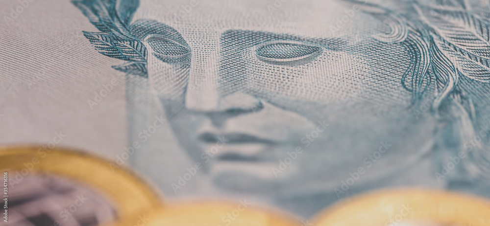 Wall mural details of 100 reais banknote from brazil, with selective focus, background image for monetary conce