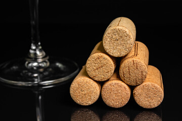red wine in a glass on a high leg on a black background