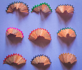 Pencil shavings arranged in rows and columns.