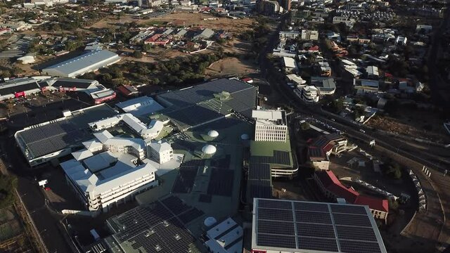 4K aerial drone video of shopping mall area in city center in Namibia's capital in central highland Khomas Hochland of Namibia, southern Africa