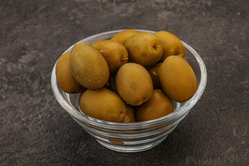 Green pickled olives in the bowl