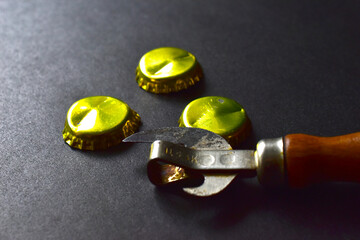 Gold beer bottle caps and bottle opener