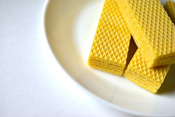Some delicious sugar waffles on a white plate