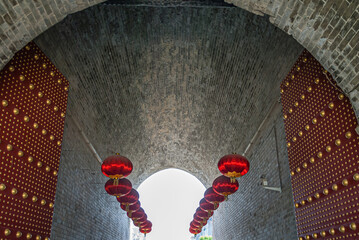 Red lanterns in entrance tunnel of North Gate on Huancheng city Wall, Xian, China.