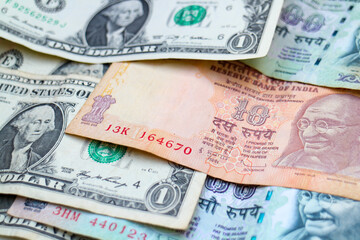 Fototapeta na wymiar Currencies of major world economies United States and India: US Dollars and Indian Rupees banknotes. 