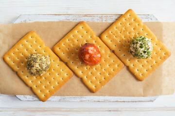 Labne balls with herbs and spices on a salty cookie. Traditional yogurt cream cheese in the Middle...