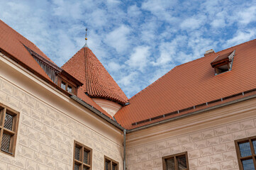 restored europian medieval castle against cloudy blue sky