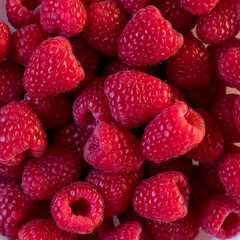 background texture of ripe fresh red raspberries