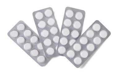 Silver packs of white tablets isolated on white background. Top view. Pharmacy concept.