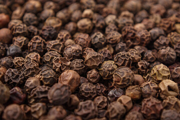 Pile of black peppercorns, close up.