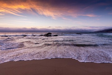 sunset on Praia do Guincho beach  Portugal