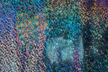 high res macro photo of abstract pastel iridescent holographic foil background with light leaks....