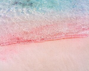 Pink sand with the turquoise waters of the Mediterranean Sea, seen at Balos Beach, Crete, Greece.