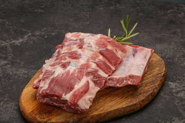 Raw pork ribs served rosemary