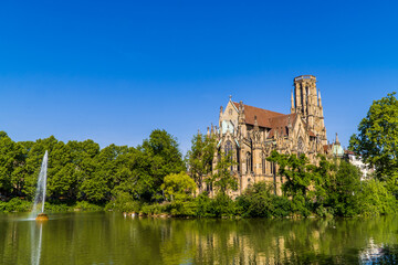 The Gothic Johanneskirche am Feuersee - Johannes church at Feuersee park witha fountain in...