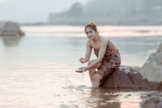 Asian sexy woman washing in streams The girl was bathing in the brook, woman washing in the stream, country girl portrait in outdoors.
