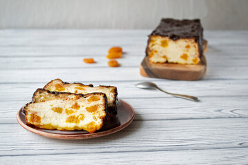 Lviv cheesecake, a traditional Ukrainian dessert with raisins, coated with chocolate icing.