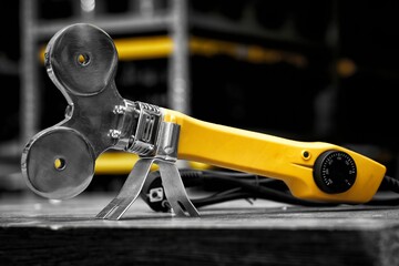 A soldering iron or welding machine for plastic polypropylene pipes with attachments and scissors...